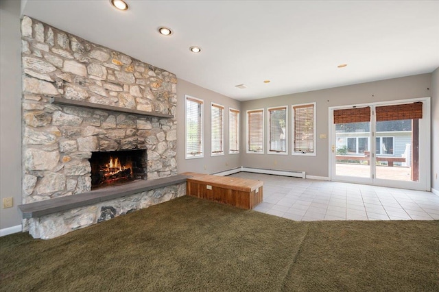 403 S 1st St, Lindenhurst, NY 11757 - unfurnished living room with baseboard heating, carpet floors, a fireplace, tile patterned flooring, and recessed lighting