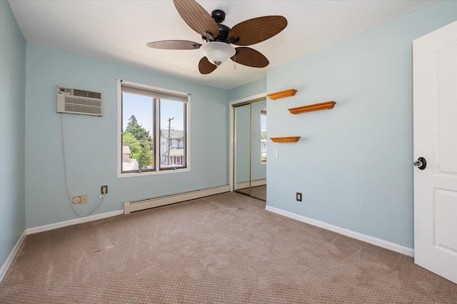 403 S 1st St, Lindenhurst, NY 11757 - unfurnished bedroom featuring a baseboard heating unit, a wall mounted AC, carpet floors, a closet, and a ceiling fan