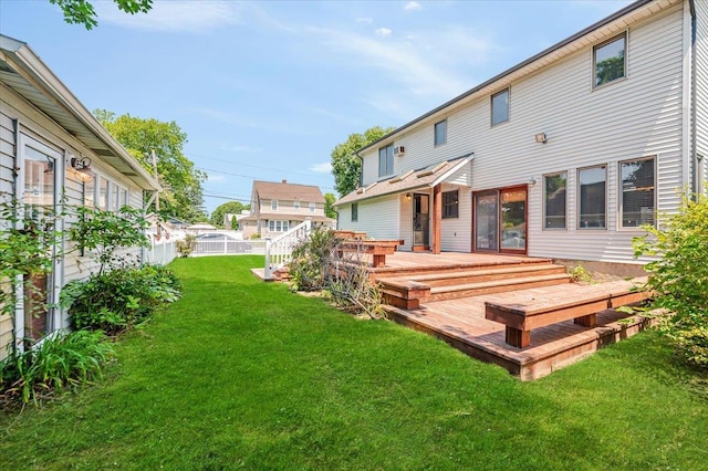 403 S 1st St, Lindenhurst, NY 11757 - rear view of house featuring a deck