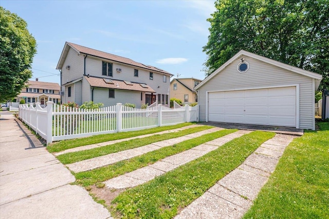 403 S 1st St, Lindenhurst, NY 11757 - view of front of home with an outdoor structure and a detached garage