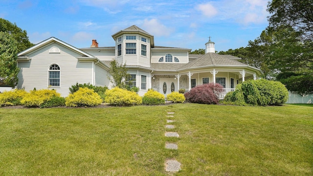 59 Lidge Dr, Farmingville, NY 11738 - victorian house featuring a chimney and a porch