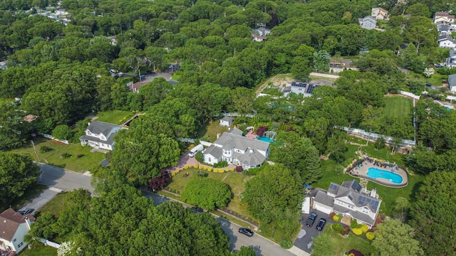 59 Lidge Dr, Farmingville, NY 11738 - aerial overview of property's location featuring a heavily wooded area and nearby suburban area