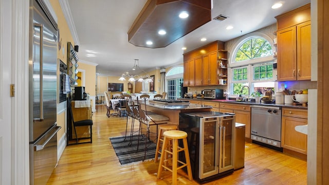 59 Lidge Dr, Farmingville, NY 11738 - kitchen with appliances with stainless steel finishes, dark countertops, open shelves, a kitchen breakfast bar, and a kitchen island