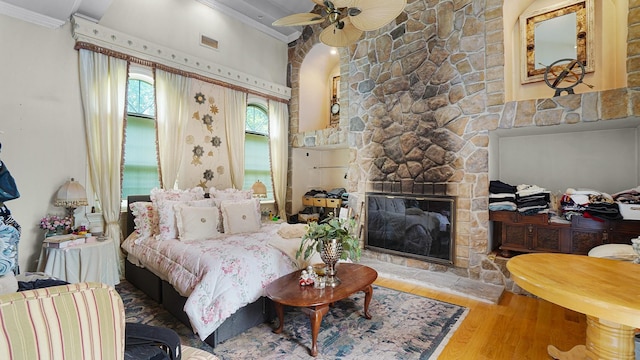 59 Lidge Dr, Farmingville, NY 11738 - bedroom featuring crown molding, wood finished floors, and a fireplace