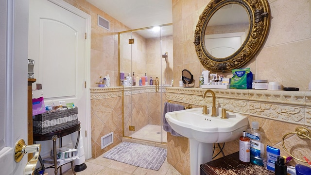 59 Lidge Dr, Farmingville, NY 11738 - bathroom with tile walls, tile patterned floors, and a stall shower