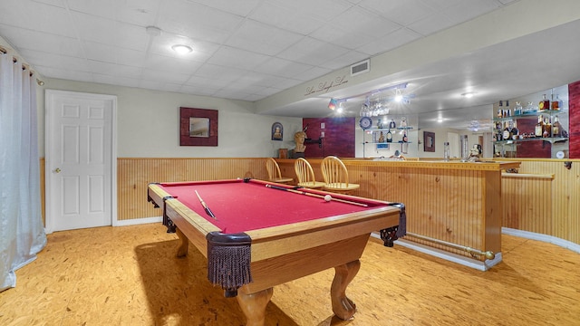 59 Lidge Dr, Farmingville, NY 11738 - recreation room featuring bar area, wainscoting, wood finished floors, pool table, and wood walls