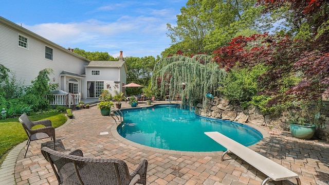 59 Lidge Dr, Farmingville, NY 11738 - swimming pool featuring a patio and a diving board
