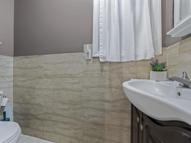 2677 Heath Ave, Bronx, NY 10463 - half bathroom with tile walls and vanity
