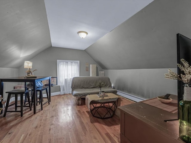 2677 Heath Ave, Bronx, NY 10463 - bedroom featuring baseboard heating, wood finished floors, and vaulted ceiling