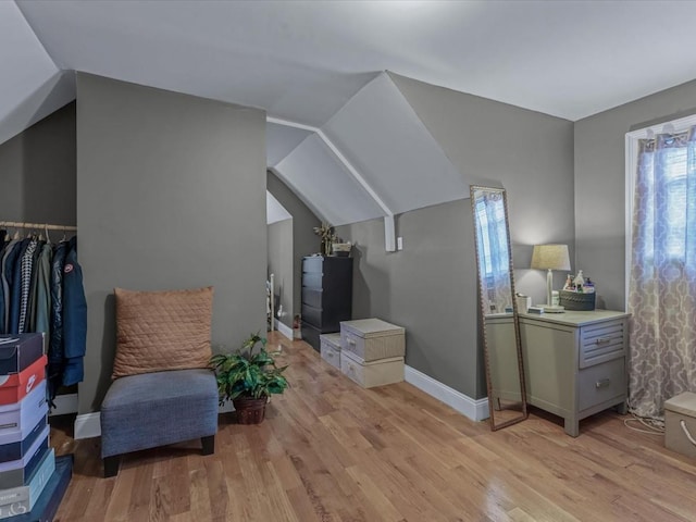 2677 Heath Ave, Bronx, NY 10463 - living area featuring plenty of natural light, light wood-type flooring, and vaulted ceiling
