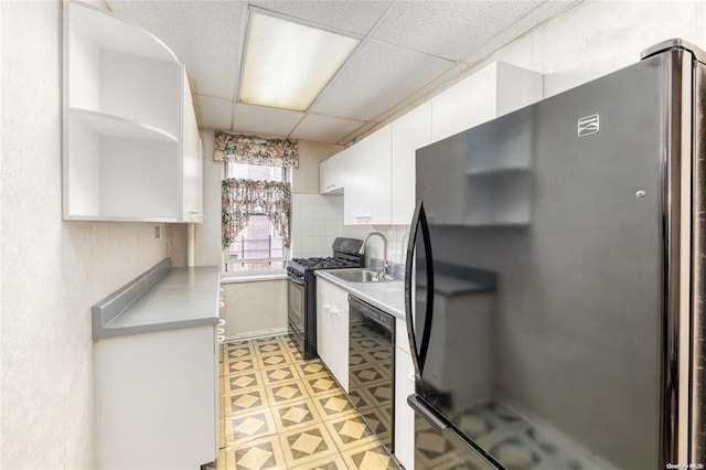 67-66 108th St Unit A58, Forest Hills, NY 11375 - kitchen featuring black appliances, white cabinetry, open shelves, a drop ceiling, and light countertops
