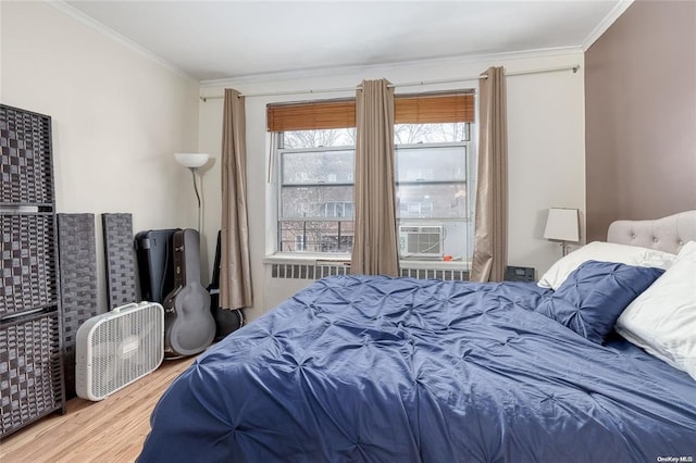67-66 108th St Unit A58, Forest Hills, NY 11375 - bedroom featuring ornamental molding, wood finished floors, and cooling unit