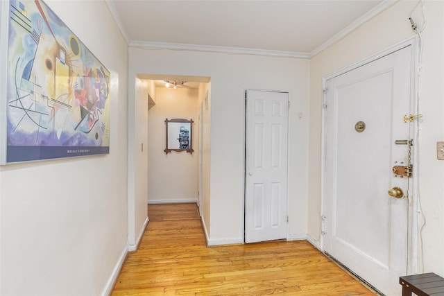 67-66 108th St Unit A58, Forest Hills, NY 11375 - entrance foyer featuring crown molding and light wood-type flooring