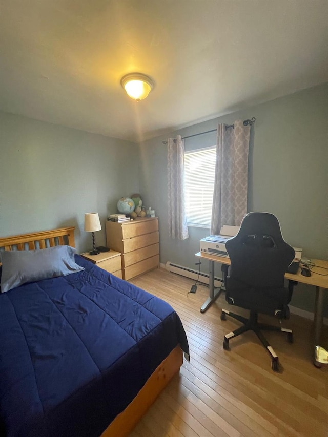 3-15 127th St, College Point, NY 11356 - bedroom featuring hardwood / wood-style flooring and baseboard heating