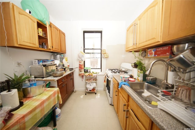 40-45 99th St, Corona, NY 11368 - kitchen with white range with gas stovetop, light countertops, and open shelves