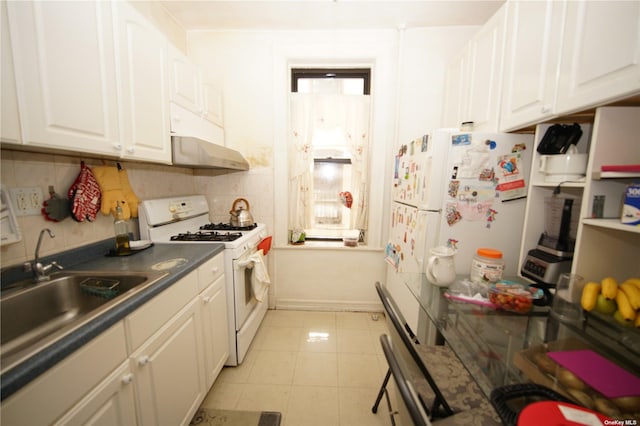 40-45 99th St, Corona, NY 11368 - kitchen with white appliances, under cabinet range hood, white cabinets, and dark countertops