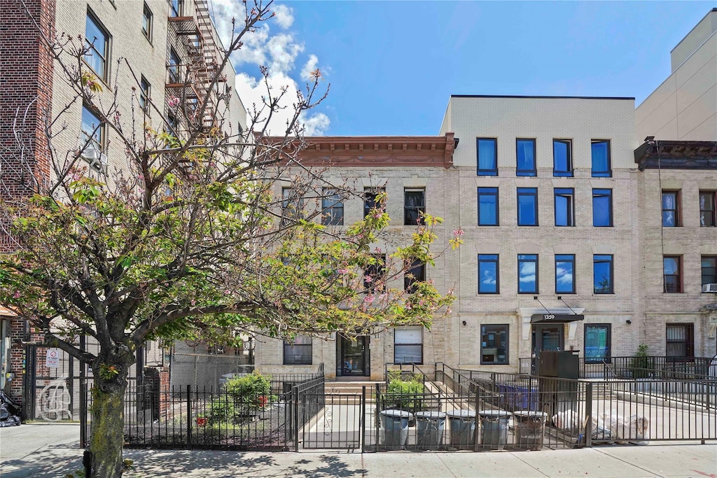 1363 Nostrand Ave, Brooklyn, NY 11226 - view of building exterior with a fenced front yard