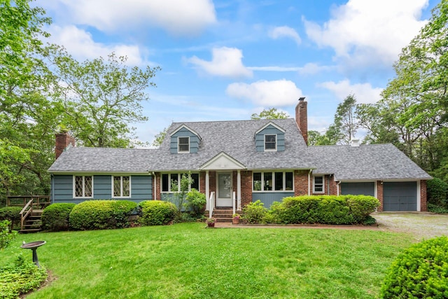 27 E Woods Dr, Cold Spring Harbor, NY 11724 - cape cod house featuring a chimney, brick siding, a front yard, a garage, and driveway