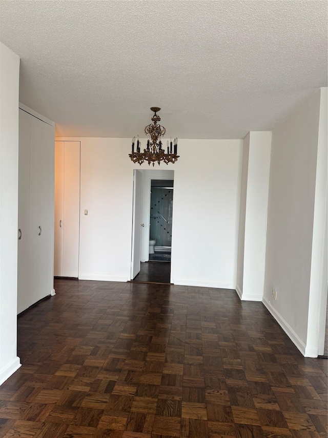 2400 Johnson Ave Unit 1K, Bronx, NY 10463 - empty room with a chandelier and a textured ceiling