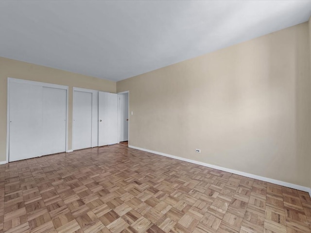 5500 Fieldstone Unit 4Ii, Bronx, NY 10471 - unfurnished bedroom featuring multiple closets and baseboards