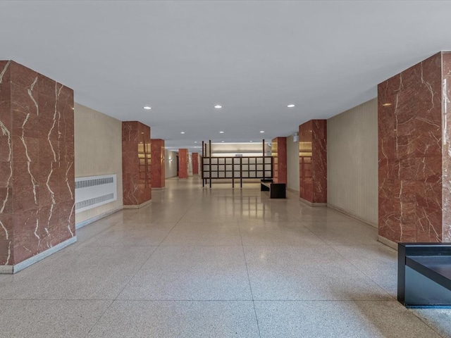 5500 Fieldstone Unit 4Ii, Bronx, NY 10471 - corridor featuring speckled floor, radiator, and recessed lighting