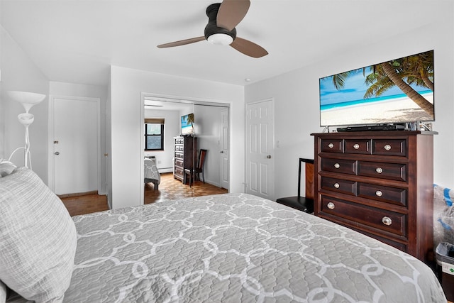 505 Central Ave Unit 408, White Plains, NY 10606 - bedroom featuring a closet, a ceiling fan, a baseboard heating unit, and wood finished floors