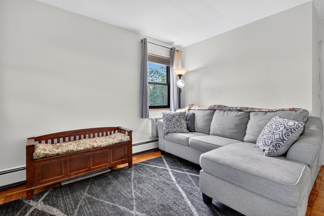 505 Central Ave Unit 408, White Plains, NY 10606 - living room featuring a baseboard heating unit and wood finished floors