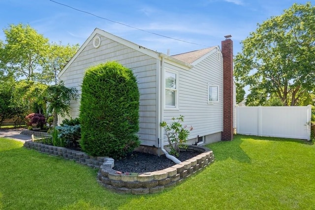 118 Pine Neck Ave, East Patchogue, NY 11772 - view of home's exterior with a chimney