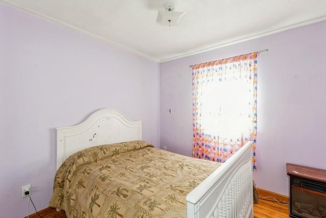 118 Pine Neck Ave, East Patchogue, NY 11772 - bedroom with crown molding and wood finished floors