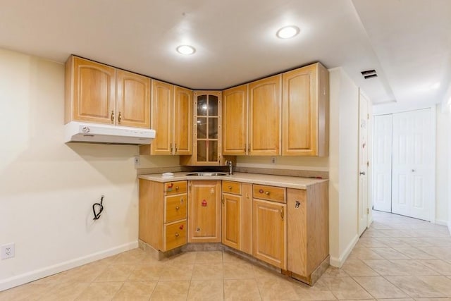 118 Pine Neck Ave, East Patchogue, NY 11772 - kitchen featuring under cabinet range hood, light tile patterned flooring, glass insert cabinets, light countertops, and recessed lighting