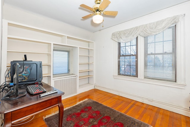136 Sturges St, Staten Island, NY 10314 - office area with radiator heating unit, wood finished floors, and ceiling fan