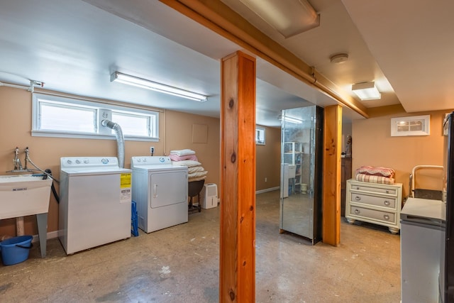 136 Sturges St, Staten Island, NY 10314 - below grade area featuring washer and clothes dryer and light floors