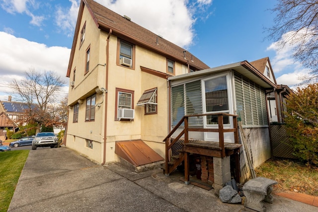 136 Sturges St, Staten Island, NY 10314 - rear view of property featuring stucco siding