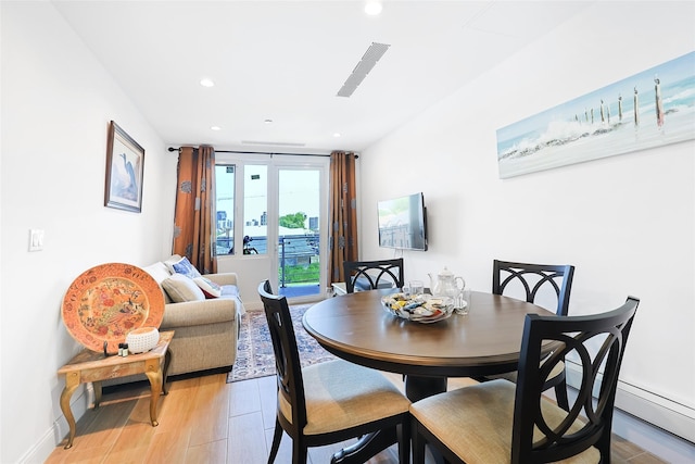 136-20 Booth Memorial Ave Unit 3H, Flushing, NY 11355 - dining area featuring light wood-style flooring and recessed lighting