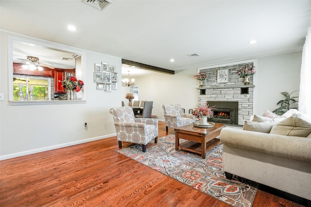 63 Lake Walton Rd, Wappingers Falls, NY 12590 - living room featuring wood finished floors, a stone fireplace, recessed lighting, ceiling fan, and a chandelier