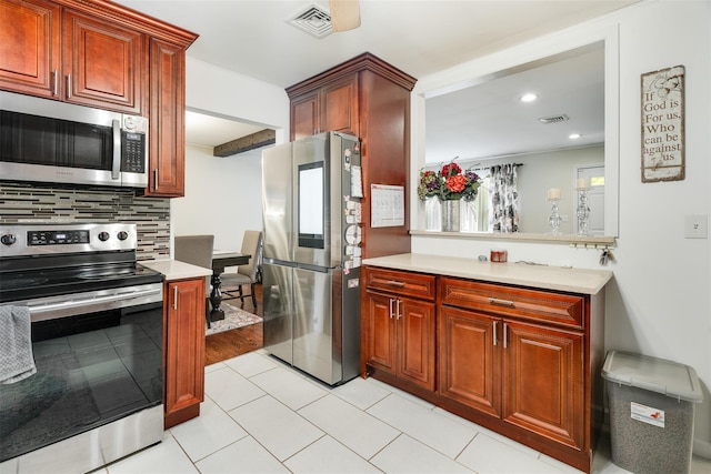 63 Lake Walton Rd, Wappingers Falls, NY 12590 - kitchen with stainless steel appliances, light countertops, decorative backsplash, recessed lighting, and light tile patterned floors