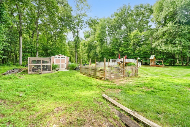 63 Lake Walton Rd, Wappingers Falls, NY 12590 - view of green lawn featuring a garden, an outdoor structure, and a playground