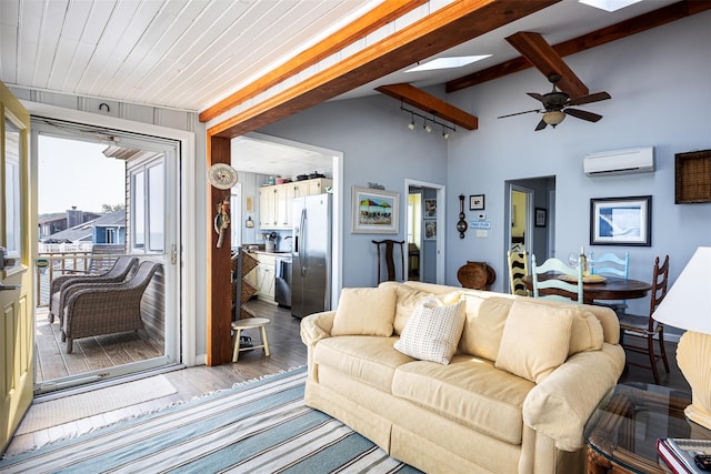 22 Creek Rd, Wading River, NY 11792 - living area featuring a wall mounted air conditioner, wood finished floors, a skylight, and ceiling fan