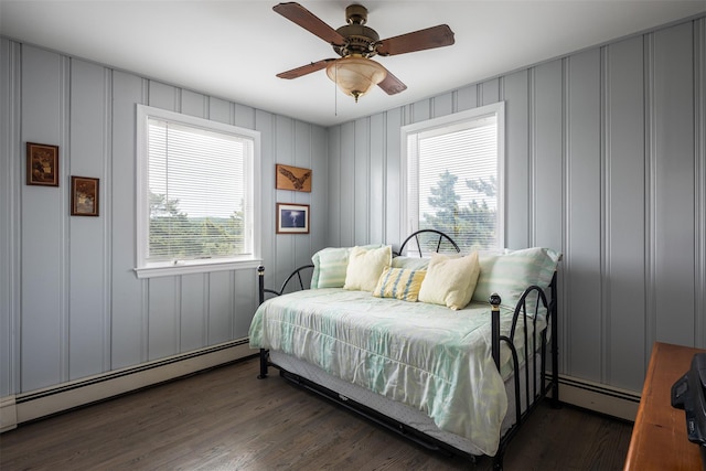 22 Creek Rd, Wading River, NY 11792 - bedroom with a decorative wall, a baseboard heating unit, wood finished floors, and a ceiling fan
