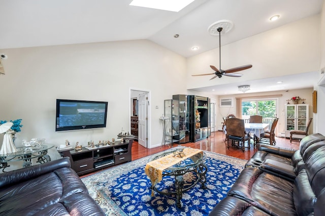 118 Grant Ave, Albertson, NY 11507 - living room with a ceiling fan, a skylight, wood finished floors, and vaulted ceiling