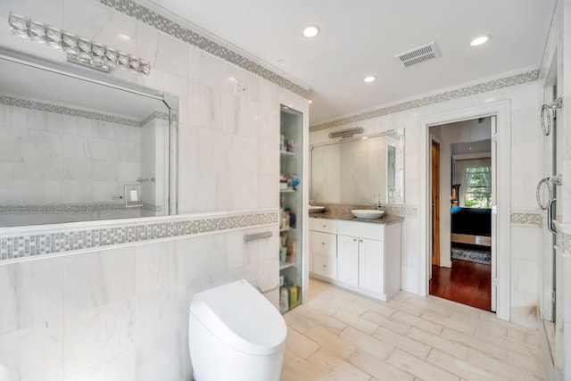 118 Grant Ave, Albertson, NY 11507 - full bathroom with a tile shower, tile walls, vanity, ornamental molding, and recessed lighting