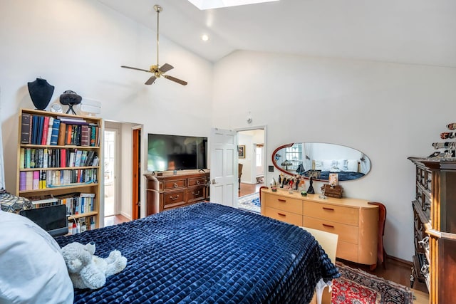 118 Grant Ave, Albertson, NY 11507 - bedroom with lofted ceiling, wood finished floors, a skylight, and ceiling fan