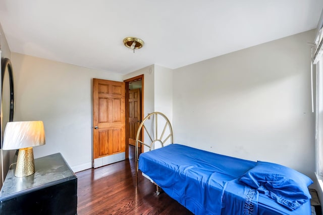 118 Grant Ave, Albertson, NY 11507 - bedroom with dark wood-style floors and baseboards