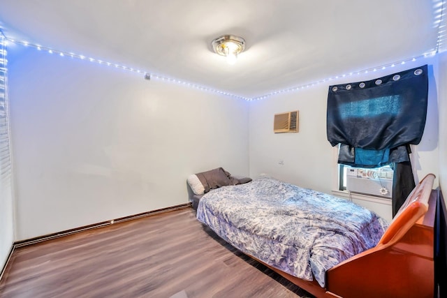 118 Grant Ave, Albertson, NY 11507 - bedroom featuring a wall unit AC, wood finished floors, and cooling unit
