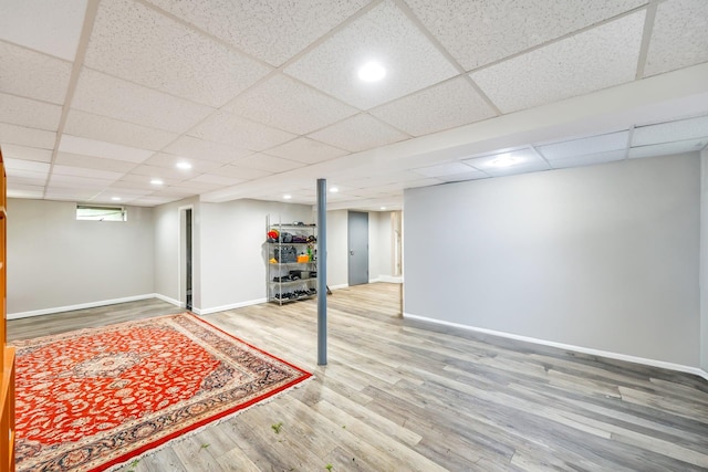 118 Grant Ave, Albertson, NY 11507 - below grade area with wood finished floors, recessed lighting, and a paneled ceiling