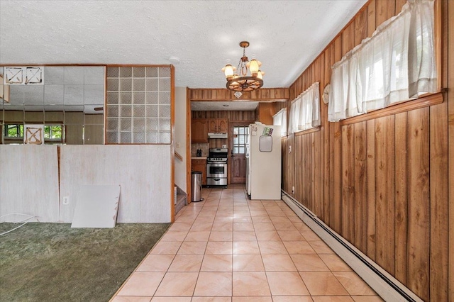 2354 7th St, East Meadow, NY 11554 - corridor with a baseboard radiator, a chandelier, light tile patterned flooring, wood walls, and plenty of natural light