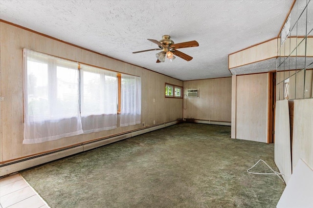2354 7th St, East Meadow, NY 11554 - carpeted empty room featuring ceiling fan, a textured ceiling, a baseboard heating unit, crown molding, and a wall unit AC