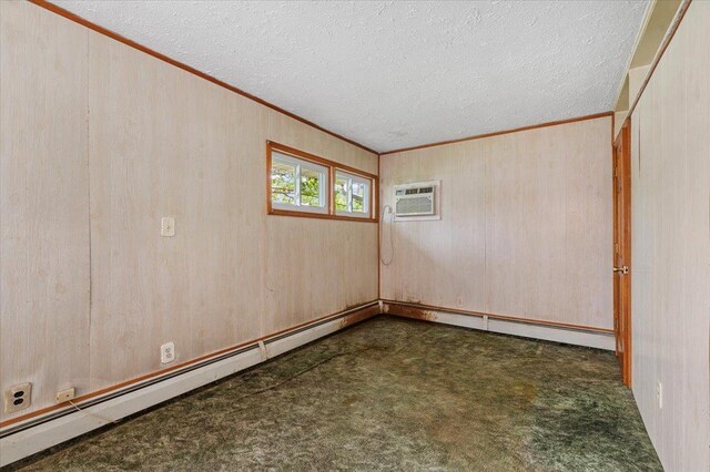 2354 7th St, East Meadow, NY 11554 - carpeted spare room featuring ornamental molding, a textured ceiling, wooden walls, and a wall mounted AC