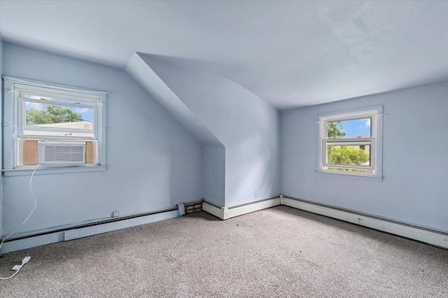 2354 7th St, East Meadow, NY 11554 - additional living space with cooling unit, carpet floors, lofted ceiling, plenty of natural light, and a baseboard heating unit
