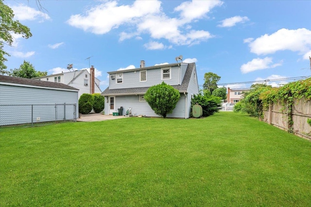 2354 7th St, East Meadow, NY 11554 - rear view of property with a patio area and a chimney